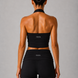 Person wearing a black halter and leggings with 'GLOA' branding on a gray background