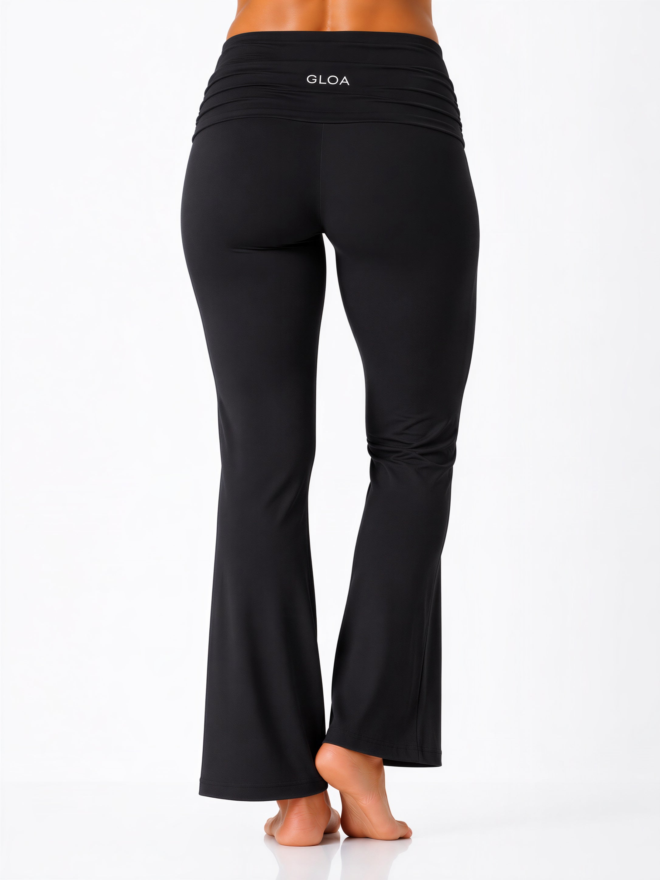 Black pants with 'GLOA' branding on a white background