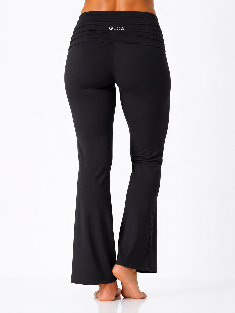 Black pants with 'GLOA' branding on a white background